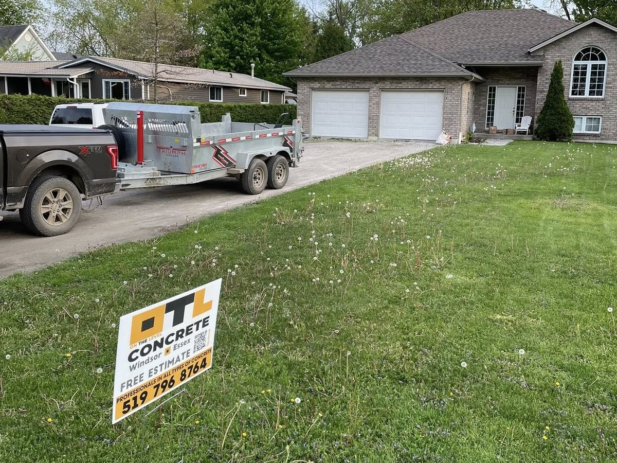 OTL Concrete site sign on a finished lawn