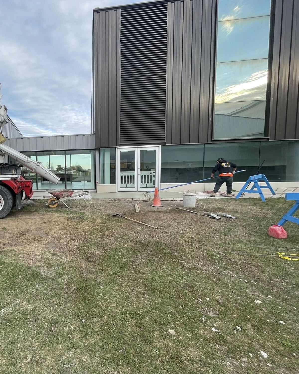 OTL Concrete crew placing concrete at a commercial building
