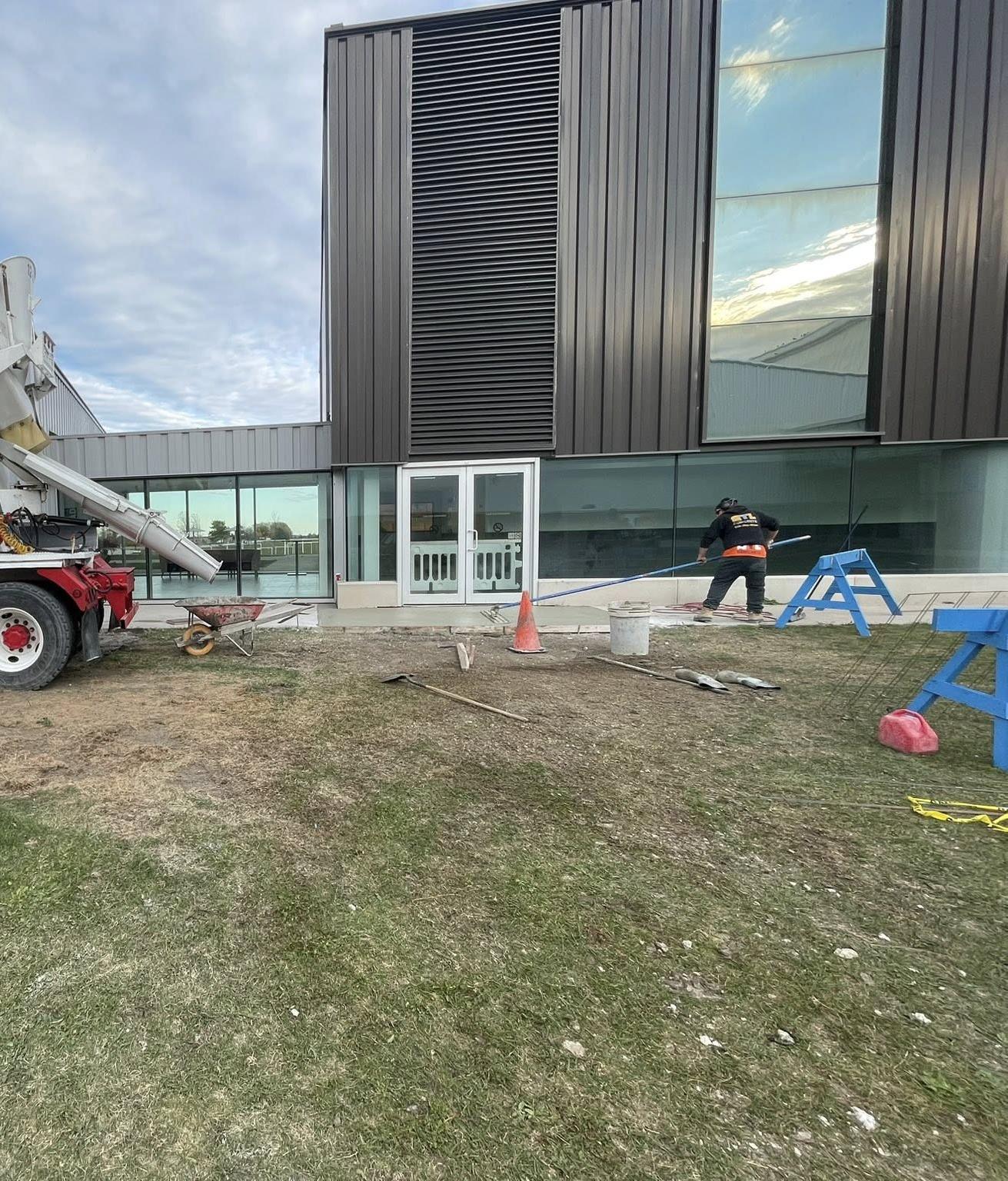 Commercial concrete walkway pour at a modern building