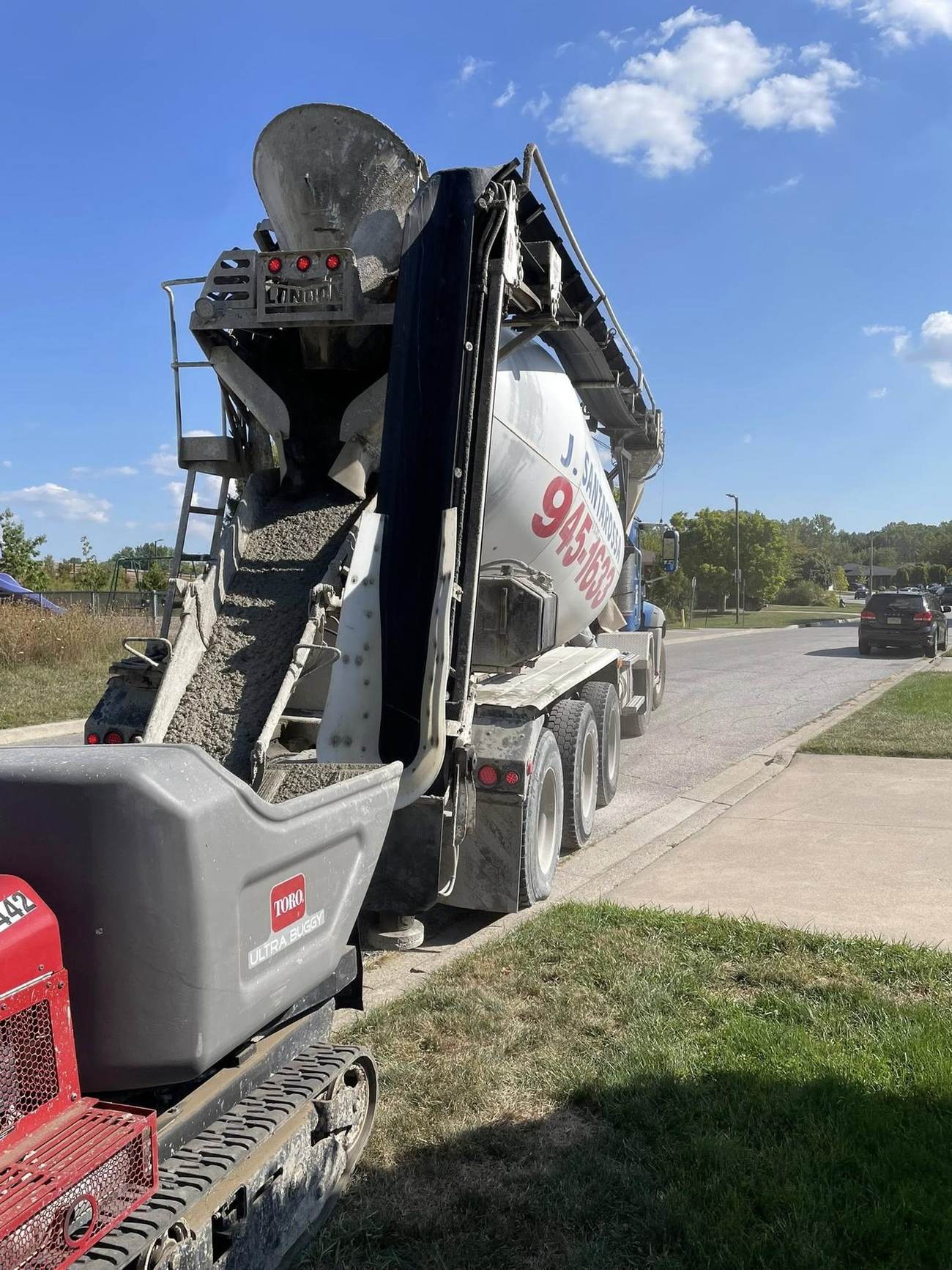 Concrete conveyor truck placing concrete