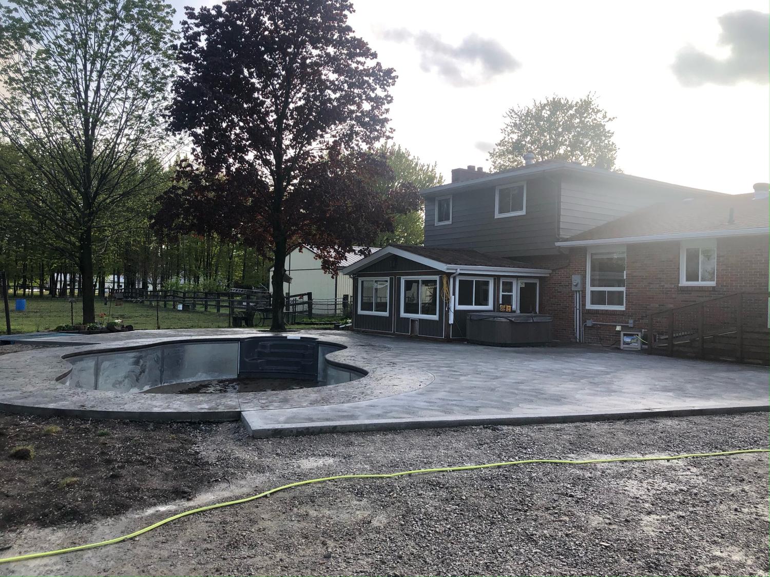Pool deck with steps and connecting walkway