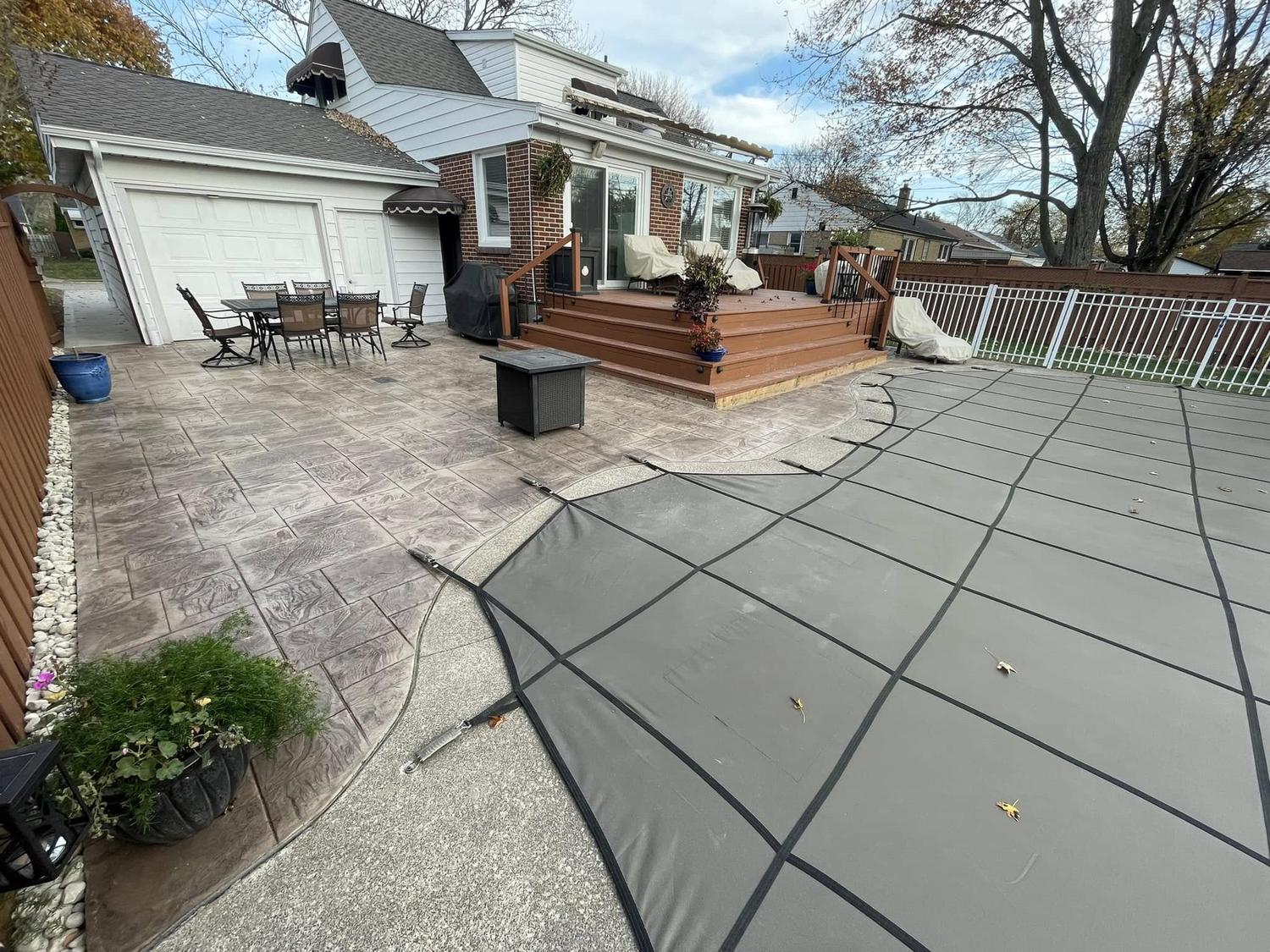 Stamped concrete patio with outdoor furniture
