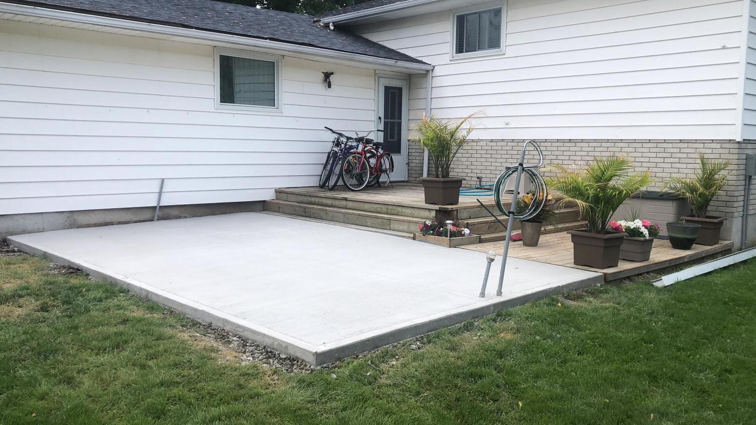 Clean broom-finished backyard patio