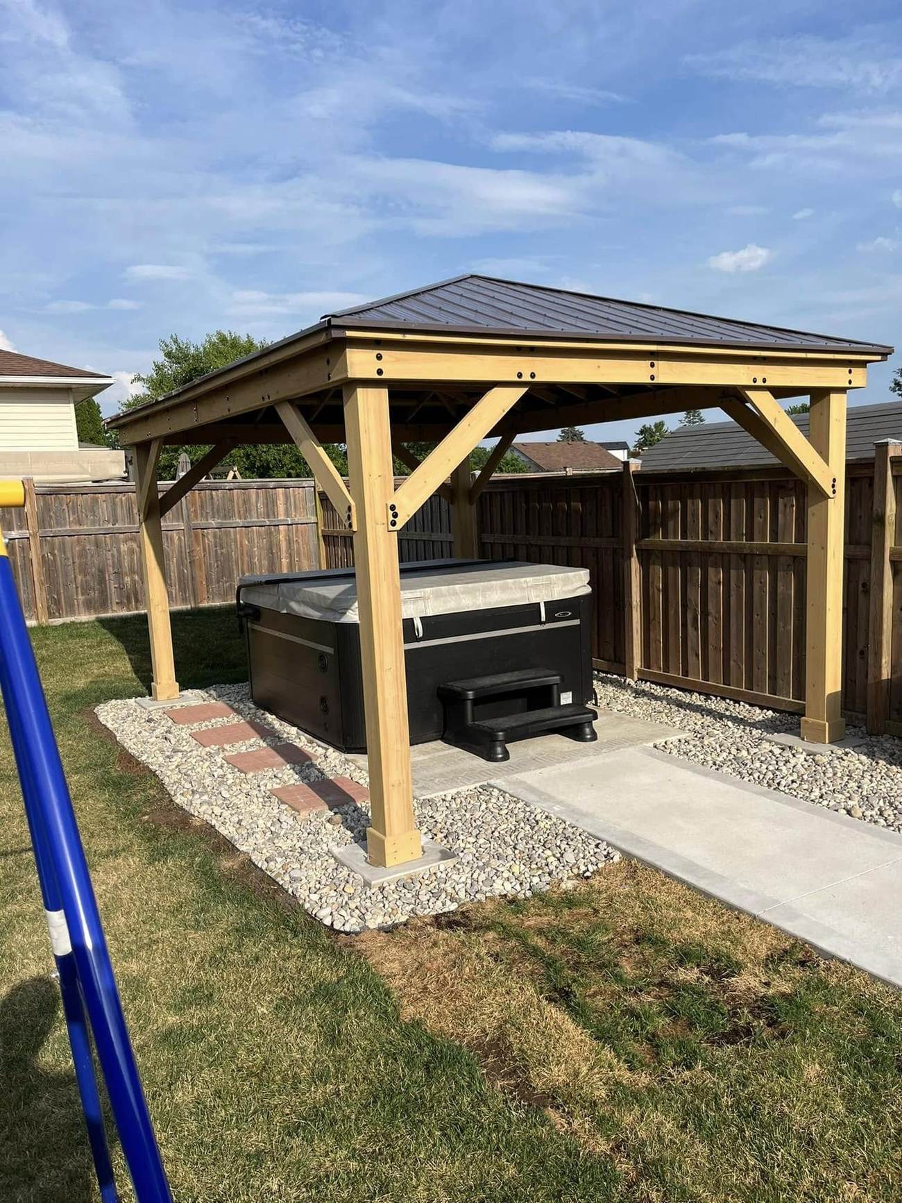 Hot tub pad with gazebo and connecting walkway